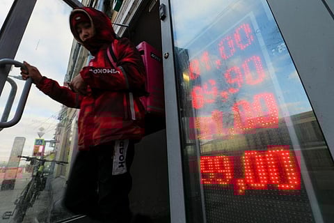 The ruble plunged to a record low of less than 1 U.S. cent in value Monday after Russia was cut off from the global bank payments system in retaliation for Moscow’s invasion of Ukraine. (Photo | AP)