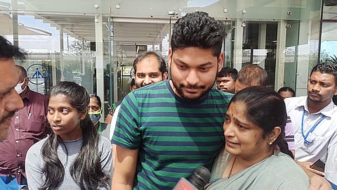 K Kavya Sree and D Sai Praveen, who hail from West Godavari and Guntur districts, come out of Vijayawada airport. (Photo | P Ravindra Babu, EPS)