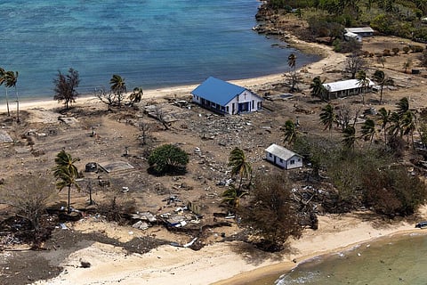 In this photo provided by the Australian Defence Force, debris from damaged building and trees are strewn around on Atata Island in Tonga. (Photo | AP)