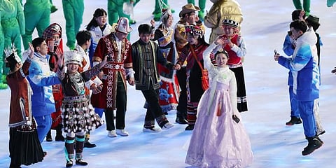 A performer, second from right, clad in a traditional Korean dress waves during the opening ceremony of the 2022 Winter Olympics in Beijing, China, Friday, Feb. 4, 2022. (Photo | AP)