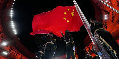 The Chinese national flag is raised during the opening ceremony of the 2022 Winter Olympics, Friday, Feb. 4, 2022, in Beijing. (Photo | AP)