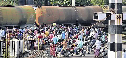 People crossing the level crossing at Korukupet station | P Jawahar