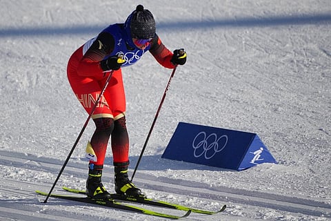 China's Yilamujiang Dinigeer competes during the women's 7.5km + 7.5km skiathlon cross-country skiing competition at the 2022 Winter Olympics. (Photo | AP)