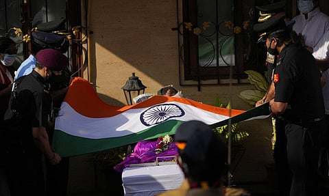 Defense forces put Indian flag on the body of Lata Mangeshkar, outside her home in Mumbai, India, Sunday, Feb.6, 2022. (Photo | AP)
