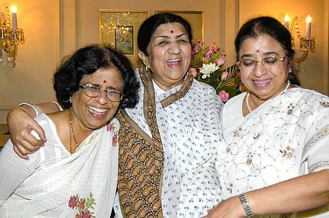 In this file image dated, Tuesday, Sept. 8, 2004, Melody Queen Lata Mungeshkar celebrates her 75th birthday with her sisters Usha and Meena Mungeshkar. (Photo | PTI)