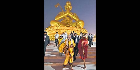 Clad in traditional attire, Prime Minister Narendra Modi walks with Chinna Jeeyar Swamy at the Statue of Equality complex after inaugurating it on Saturday. (Photo | EPS)