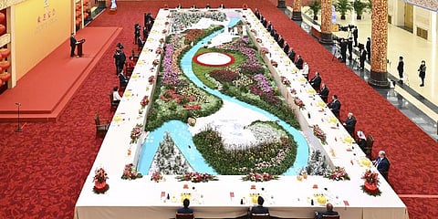 Chinese President seen on podium and his wife Peng Liyuan host a banquet to welcome distinguished guests from around the world who attended the opening ceremony of the Winter Olympics.(Photo | AP)