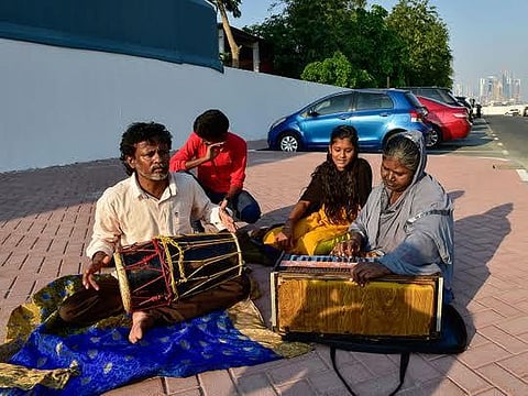 Babu Bhai, wife Latha and children singing in a street of Kozhikode