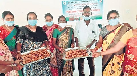 Members of the SHG at Nagaram village in Peddapalli district display their biscuits made from millets and jaggery on Saturday.