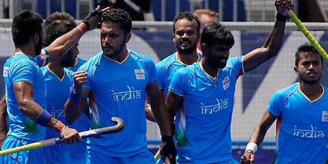 India's Harmanpreet Singh, center left, pumps his fist after scoring during a men's field hockey semi-final match against Belgium at the 2020 Summer Olympics in Tokyo, Japan. (File Photo | AP)