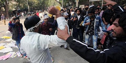 Student activists shout slogans during a protest demanding reopening of the Delhi University. (Photo| ANI)