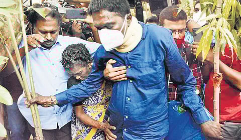 Vava Suresh’s mother Krishnamma and others helping him enter their house at Sreekaryam Cheruvakkal in Thiruvananthapuram on Monday | Vincent Pulickal