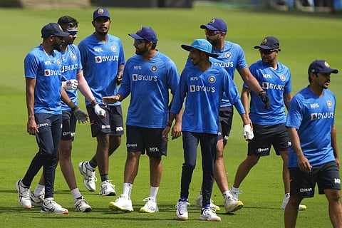 India's captain Rohit Sharma, fourth from left, talks with his teammates during a practice session ahead of their first ODI against West Indies, in Ahmedabad. (Photo | AP)