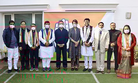 A day after ditching BJP, MLAs Sudip Roy Barman (3rd from left) and Ashis Kumar Saha (4th from left) joined the Congress in New Delhi on Tuesday.