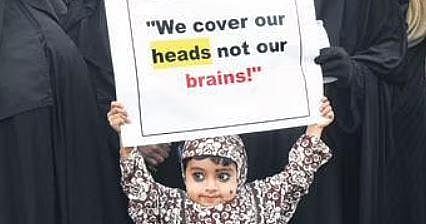 Women wearing burqa protest against the ban on headscarves on campuses, in Bengaluru on Monday | Vinod Kumar T