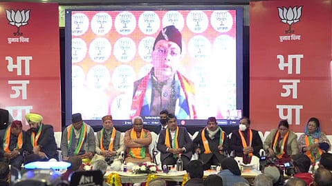 Union Road Transport Minister Nitin Gadkari, state BJP president Madan Kaushik, former CMs Ramesh Pokhriyal Nishank, Tirath Singh Rawat and Trivendra Singh Rawat at the manifesto release event in D