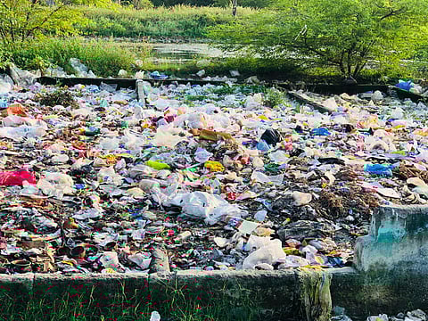 Waste dumped in pits in Sirukudal village in Perambalur district (Photo | Express)