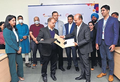 DIAL members with IIT-Delhi team after signing the agreement on Monday. (Photo | Express)