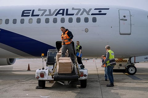 Workers load packages of Israeli humanitarian aid to assist people caught up in the fighting in Ukraine, in Ben Gurion airport in Lod, Israel,. ( Photo | AP)