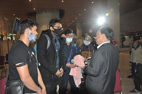 Union Minister Narayan Rane having a word with Indians who returned from Ukraine on Tuesday.