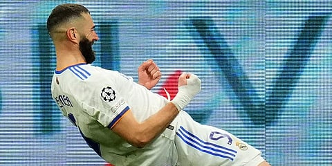 Real Madrid's Karim Benzema celebrates scoring his side's third goal during the Champions League, round of 16, second leg match against PSG on March 9, 2022. (Photo | AP)