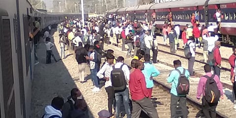 Passengers seen standing in railway tracks near Tyakal station after two commuter trains came to a halt on Wednesday due to power failure issues.