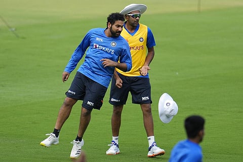 India's captain Rohit Sharma, left, runs past teammate Ravichandran Ashwin as they participate in a training session ahead of the second cricket test match. (Photo | AP)