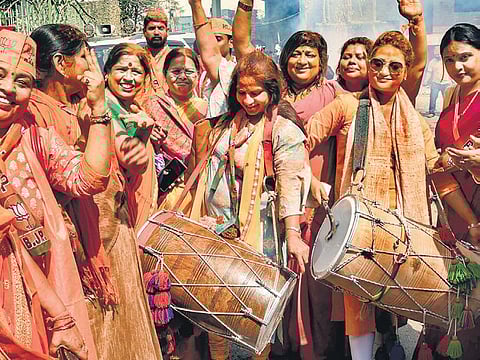 BJP workers rejoice in the streets of Varanasi on Thursday. (Photo | PTI)