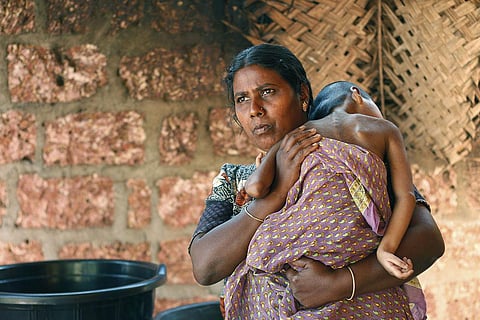 Endosulfan survivor Arpitha lies on mother Usha's shoulder. (File Photo | TP Sooraj, EPS)