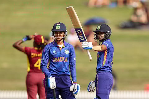 India batter Harmanpreet Kaur gestures towards the dressing room after shescored a century during their World Cup match against New Zealand, Mar 12, 2022. (Photo | BCCI Women, Twitter)