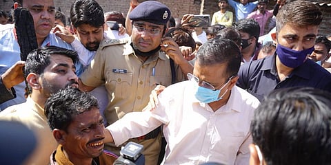 Delhi CM Arvind Kejriwal with kin of the victims of the fire in a Gokulpuri slum. (Photo| Twitter)
