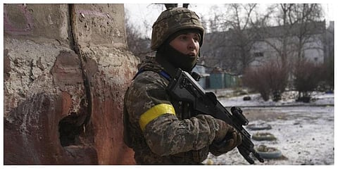 A Ukrainian serviceman guards his position in Mariupol, Ukraine. (Photo | AP)