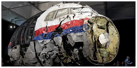This file photo, shows the reconstructed wreckage of Malaysia Airlines Flight MH17, put on display during a press conference in Gilze-Rijen, central Netherlands. (Photo | AP)