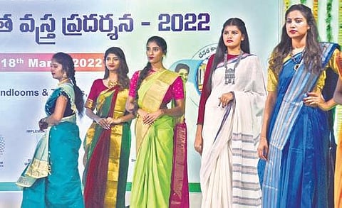 Models showcasing handloom sarees during the National Handloom Expo organised by APCO in Vijayawada on Sunday | P Ravindra Babu