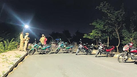 In a bid to capture the sloth bear that had strayed at Satavahana University in Karimnagar, forest authorities block a part of the internal road. (Photo| EPS)