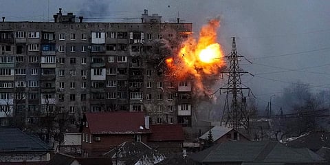 An explosion is seen in an apartment building after Russian's army tank fires in Mariupol, Ukraine. (File Photo | AP)