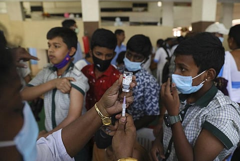 A health worker prepares the Corbevax vaccine for COVID-19 at a health center in Hyderabad. (Photo | PTI)