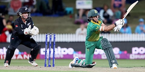 South Africa’s Marizanne Kapp (R) plays a shot during the 2022 Women's Cricket World Cup match against New Zealand at Seddon Park in Hamilton. (Photo | AFP)