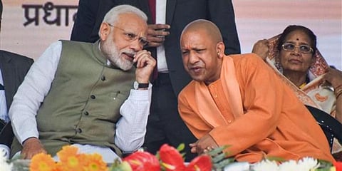 PM Narendra Modi (L) interacts with Uttar Pradesh CM Yogi Adityanath. (File Photo | PTI)