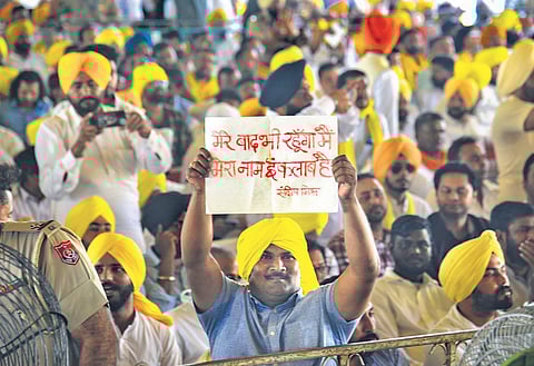 People donning yellow turban at the oath-taking ceremony of Bhagwant Mann. (Photo | PTI)