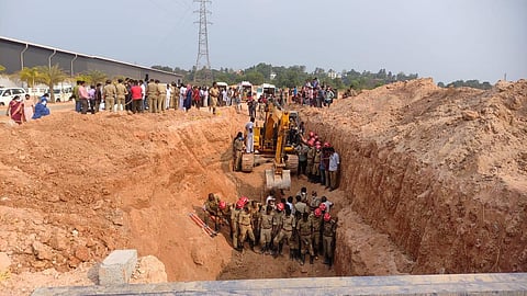Fire and Rescue workers engaged in rescue operations at the construction site where a landslip killed four workers near Ernakulam medical college at Kalamasserry on Friday.