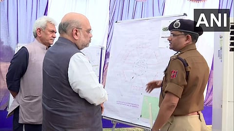 Union Home Minister Amit Shah along with Lt Governor Manoj Sinha chairs a security review meeting with senior officials at Raj Bhawan in Jammu. (Photo | ANI Twitter)