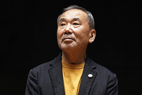 Japanese novelist Haruki Murakami poses for media during a press conference on the university's new international house of literature as known as The Haruki Murakami Library. (Photo | AP)