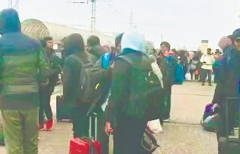 Indian students wait to board trains at a railway station in Kharkiv on Tuesday