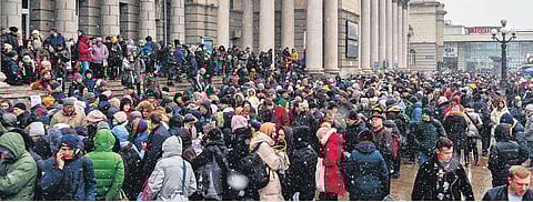 People fleeing a conflict zone throng a train station in Dnipro in eastern Ukraine braving a harsh weather on Sunday to catch evacuation trains. (File photo| AFP)