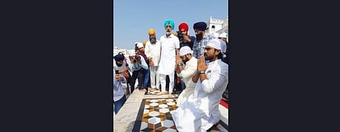 The team of S.S. Rajamouli's magnum opus 'RRR' including NTR Jr, Ram Charan and Rajamouli visited the Golden Temple in Amritsar to seek blessings for their movie. (Photo | IANS)