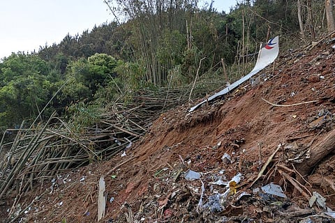 A piece of wreckage of the China Eastern's flight MU5735 are seen after it crashed on the mountain in Tengxian County. (Photo | AP)