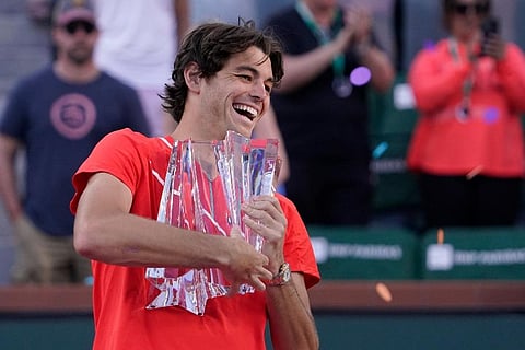 Taylor Fritz holds up his trophy after defeating Rafael Nadal, of Spain, after the men's singles finals at the BNP Paribas Open tennis tournament . ( Photo | AP)