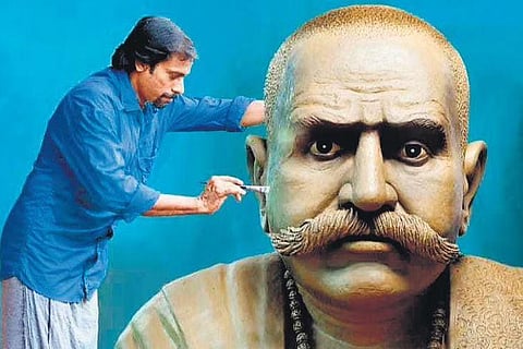 Sculptor Unni Kanayi giving final touches to the bronze bust of C V Raman Pillai