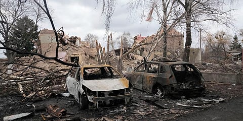 Gutted cars following a night air raid in the village of Bushiv, 40 kilometers west of Kyiv, Ukraine. (Photo| AP)
